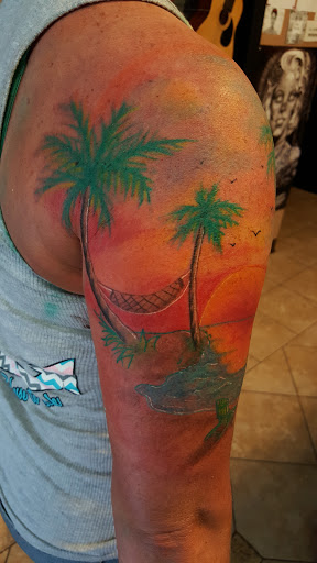 Explore cover up tattoo ideas female leg, creative tattoo ideas in Wilson, available at New Addiction Tattoos