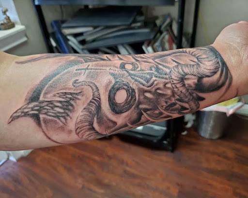 Explore hand tattoos ideas for men, creative tattoo ideas in Fontana, available at Inkspot Tattoo