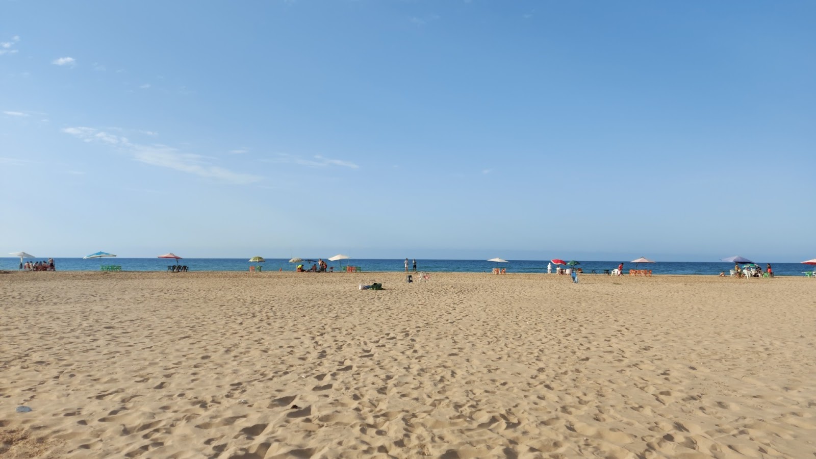 Foto av Melia beach med turkos rent vatten yta