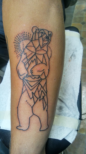 Find in between breast tattoo ideas for your next unique tattoo in Big Spring at A Mom & Pop Tattoo Shop