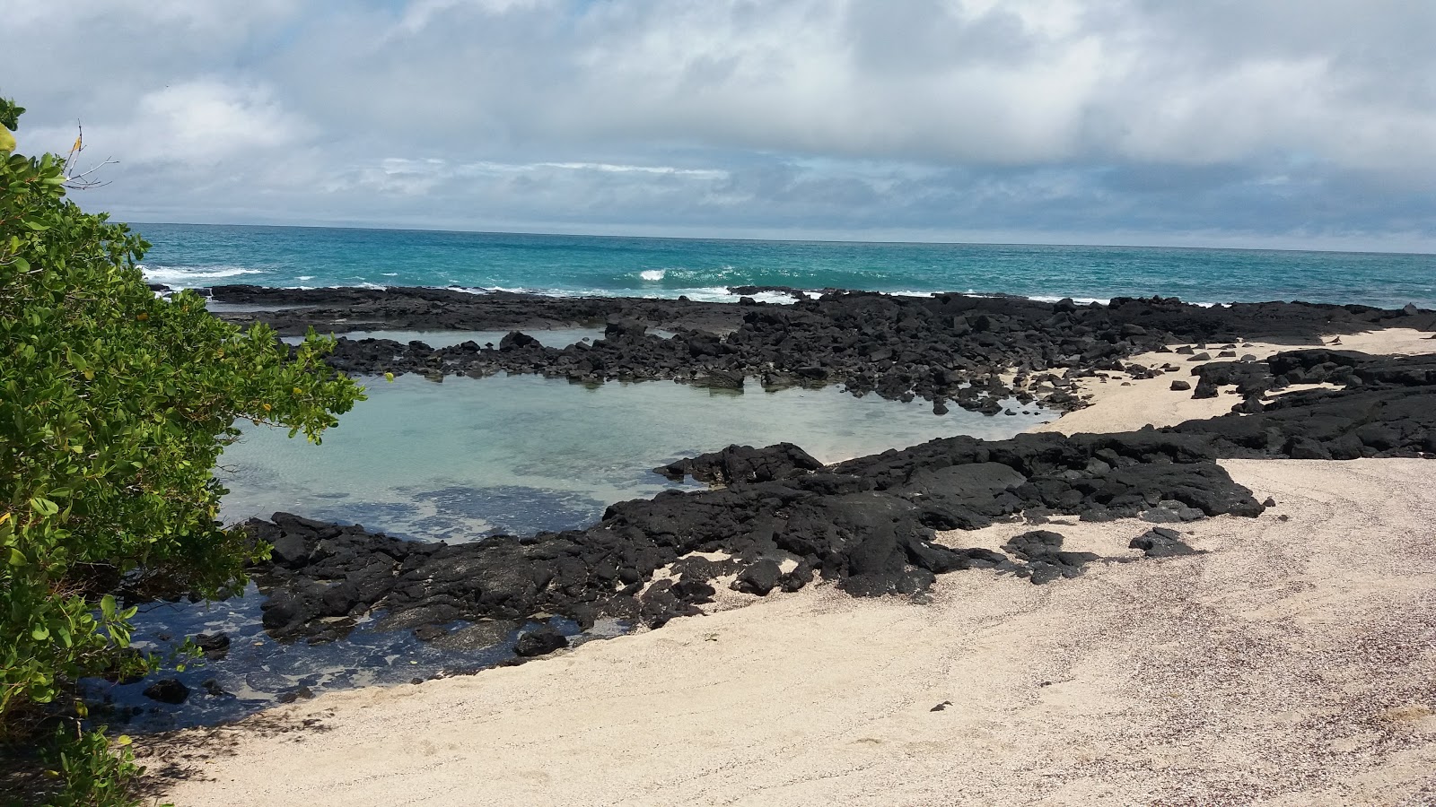 Valokuva Playa del Amorista. pinnalla turkoosi puhdas vesi:n kanssa