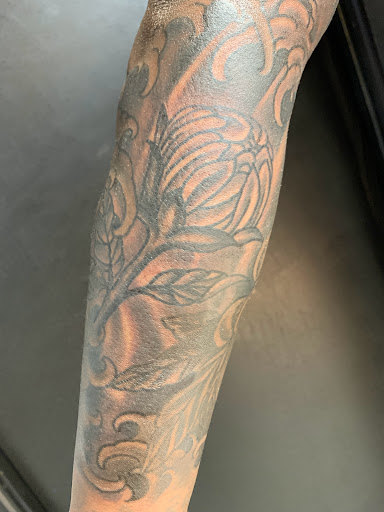 Explore cover up tattoo ideas for shoulder, creative tattoo ideas in Neptune, available at Neptune Tattooville