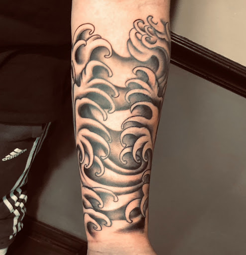 Explore lion and the lamb tattoo ideas, creative tattoo ideas in Webster, available at Mainline Ink