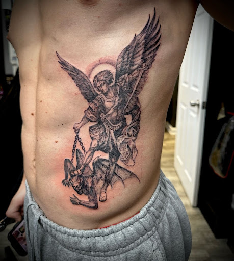 Explore knee tattoo ideas for men, creative tattoo ideas in Amherst, available at Lovesick Tattoo NH