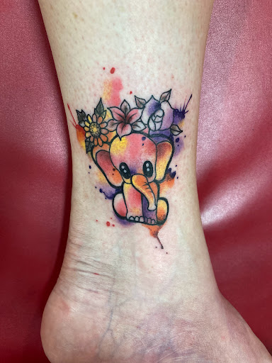 Explore december birth flower tattoo ideas, creative tattoo ideas in Las Vegas, available at Las Vegas Tattoo Collective, LLC