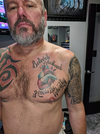 Explore calf muscle tattoo ideas, creative tattoo ideas in Edgewood, available at Evolved Body Arts