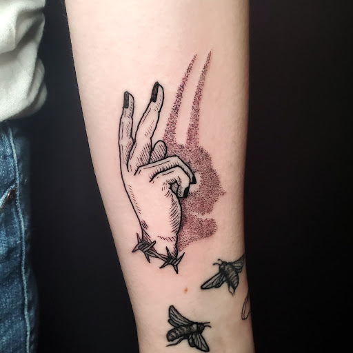 Explore finger hand tattoo ideas, creative tattoo ideas in Stevens Point, available at International Ink Tattoos