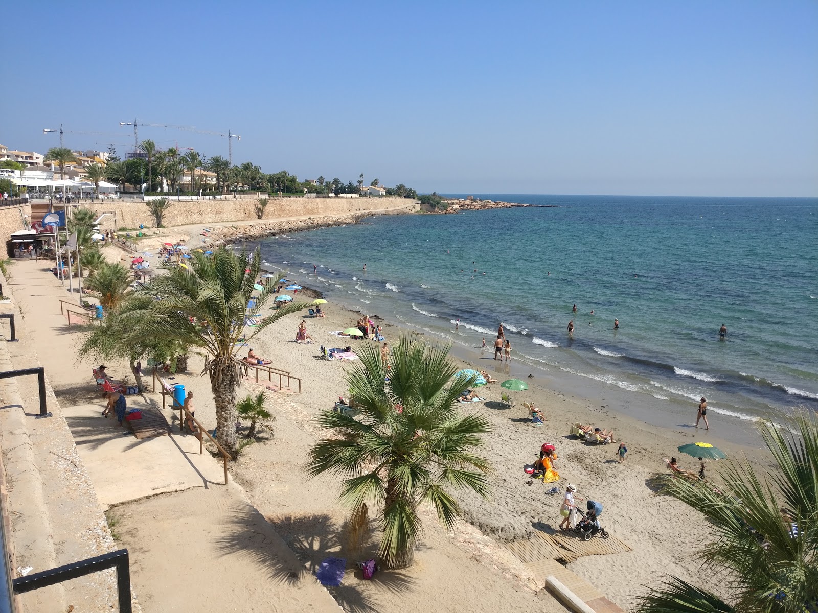 Foto van Playa Punta Prima en de nederzetting