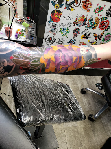 Explore blackout sleeve tattoo ideas, creative tattoo ideas in Kansas City, available at Revelation Tattoo