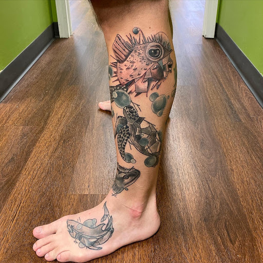 Explore black and gray tattoo sleeve ideas, creative tattoo ideas in Springfield, available at Poke and a Rub art studio