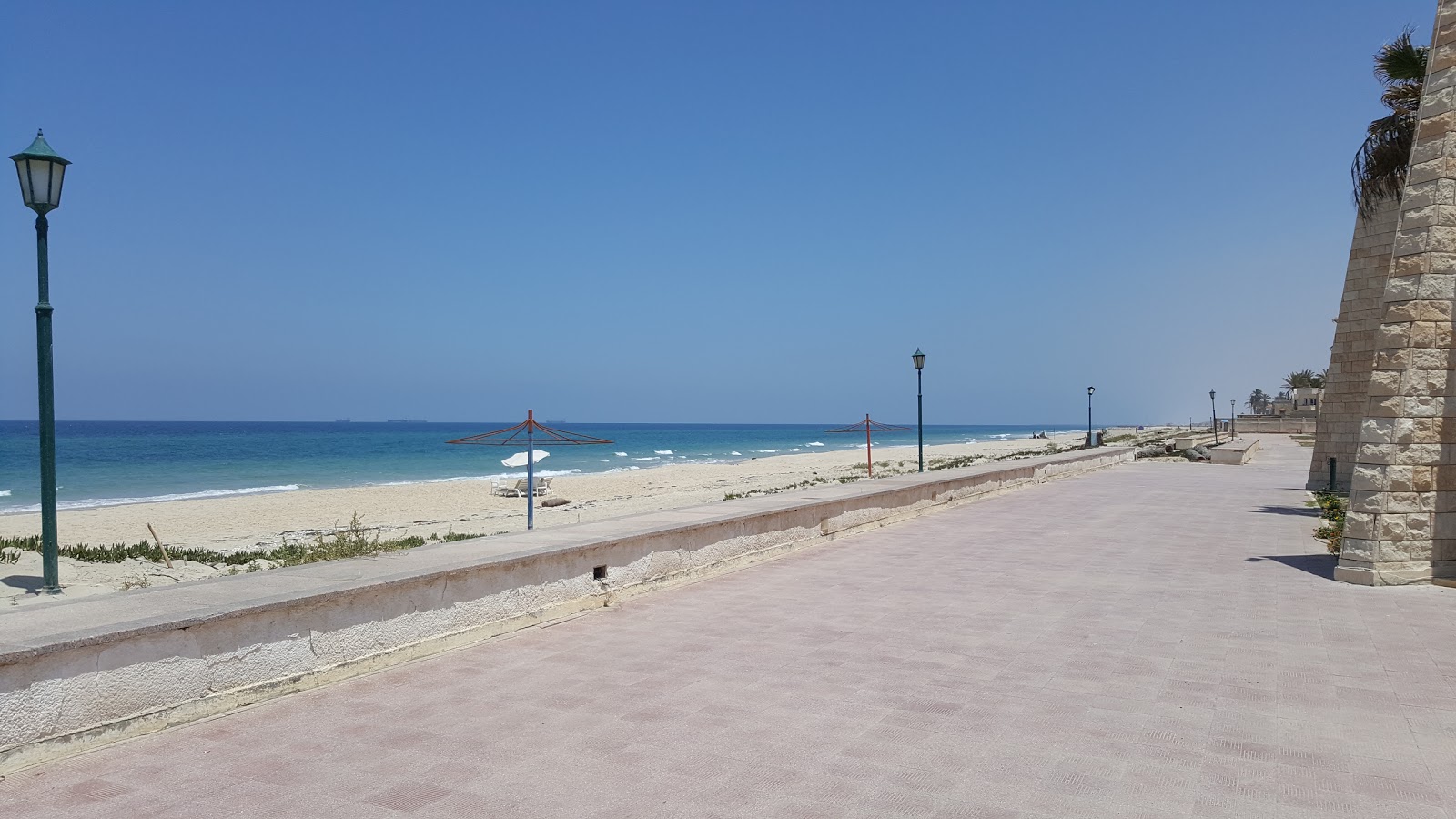 Photo de Shokry Al Kotaly Beach avec droit et long