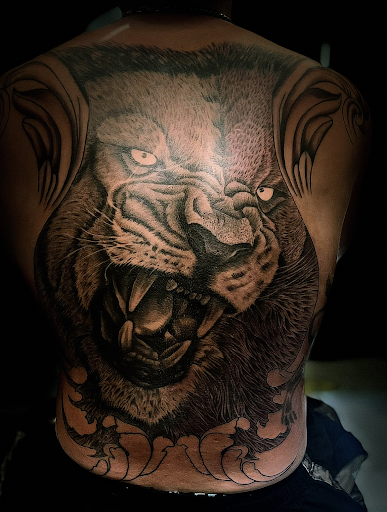 Explore betrayal tattoo ideas, creative tattoo ideas in Cadillac, available at Limitless Ink Tattoo Studio