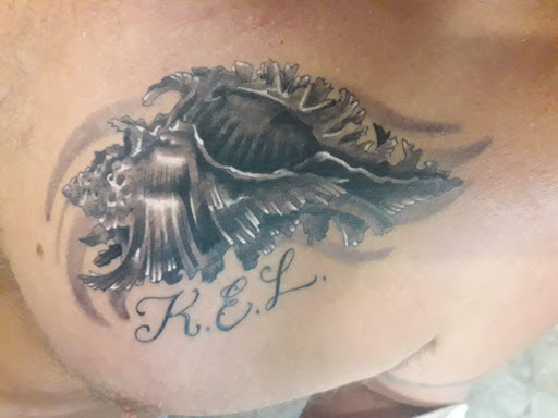 Explore spine tattoo cover up ideas, creative tattoo ideas in Cocoa Beach, available at The Corner Tattoo and Piercing Studio
