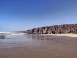 Plage Imin Turga'in fotoğrafı geniş bir kıyı şeridi ile birlikte