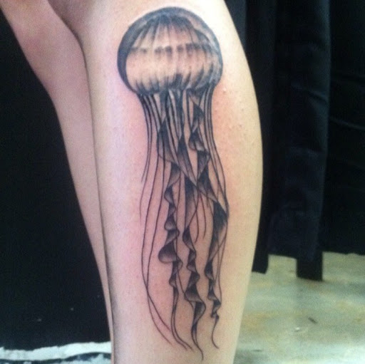 Explore arm sleeve tattoo ideas for men, creative tattoo ideas in San Diego, available at Sideshow Tattoo and Piercing