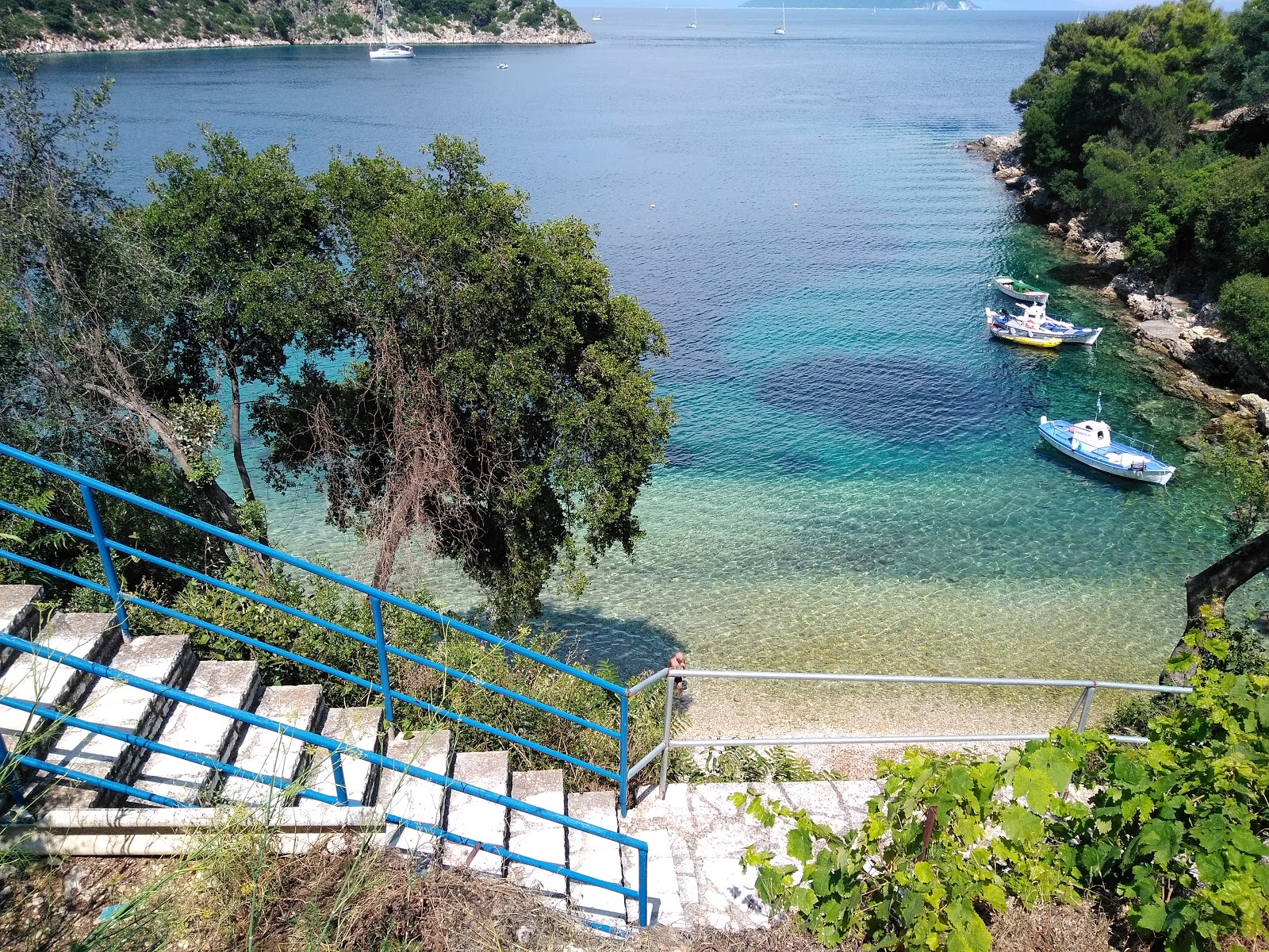 Photo of Karaiskakis house with turquoise pure water surface