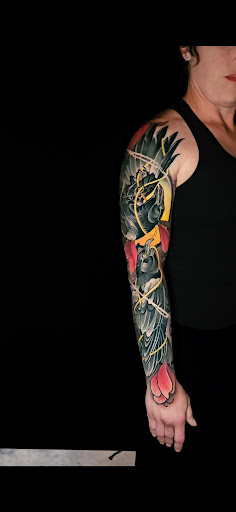 Explore wolf tattoo ideas for guys, creative tattoo ideas in Albuquerque, available at Golden Needle Tattoo Studio