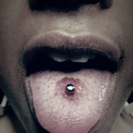 Explore elegant spine tattoo ideas, creative tattoo ideas in Raleigh, available at The Room Body Piercing Studio