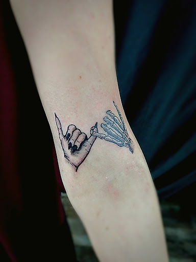 Explore wrap around wrist tattoo ideas, creative tattoo ideas in Lafayette, available at Evil Genius Tattoo Club