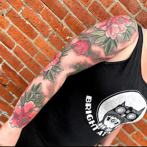 Explore ball python tattoo ideas, creative tattoo ideas in Delaware, available at Rose & Web Tattoo