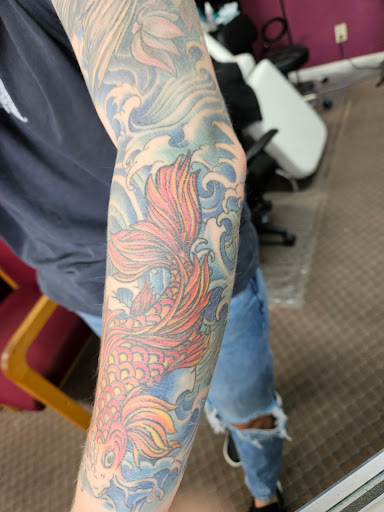 Explore back piece tattoo ideas, creative tattoo ideas in Angola, available at Hoodlum Ink