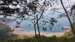 Gomu Beach'in fotoğrafı düz ve uzun ile birlikte