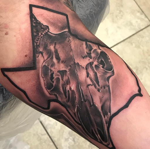 Explore lower back cover up tattoo ideas, creative tattoo ideas in Katy, available at Artistic Impressions Tattoo Studio