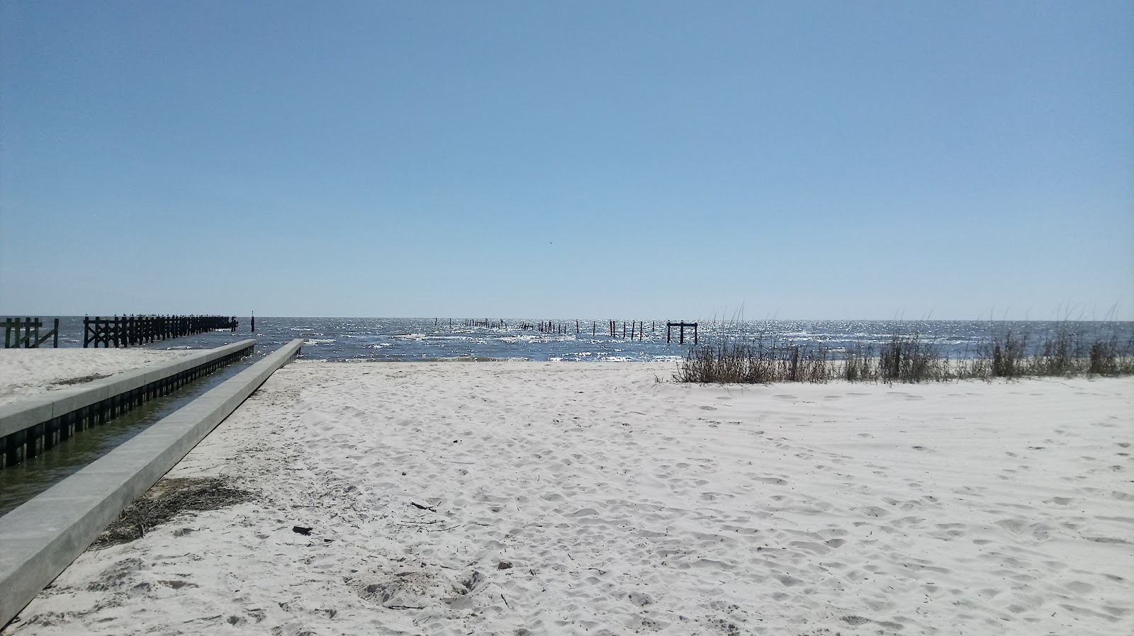 Photo de Waveland Pier beach - bon endroit convivial pour les animaux de compagnie pour les vacances