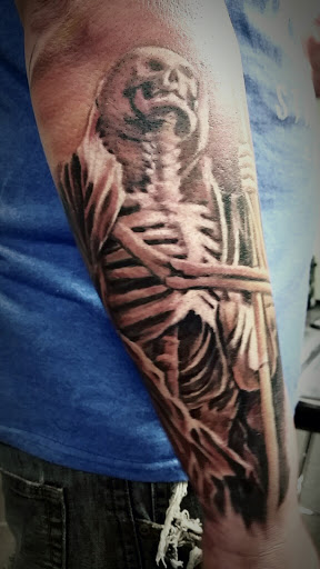 Find christmas tattoo ideas for your next unique tattoo in San Antonio at Firme Copias Tattoo Studio