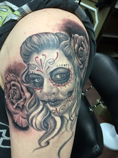 Explore kneecap tattoo ideas, creative tattoo ideas in Peoria, available at Iron Key Tattoo Studio Inc.