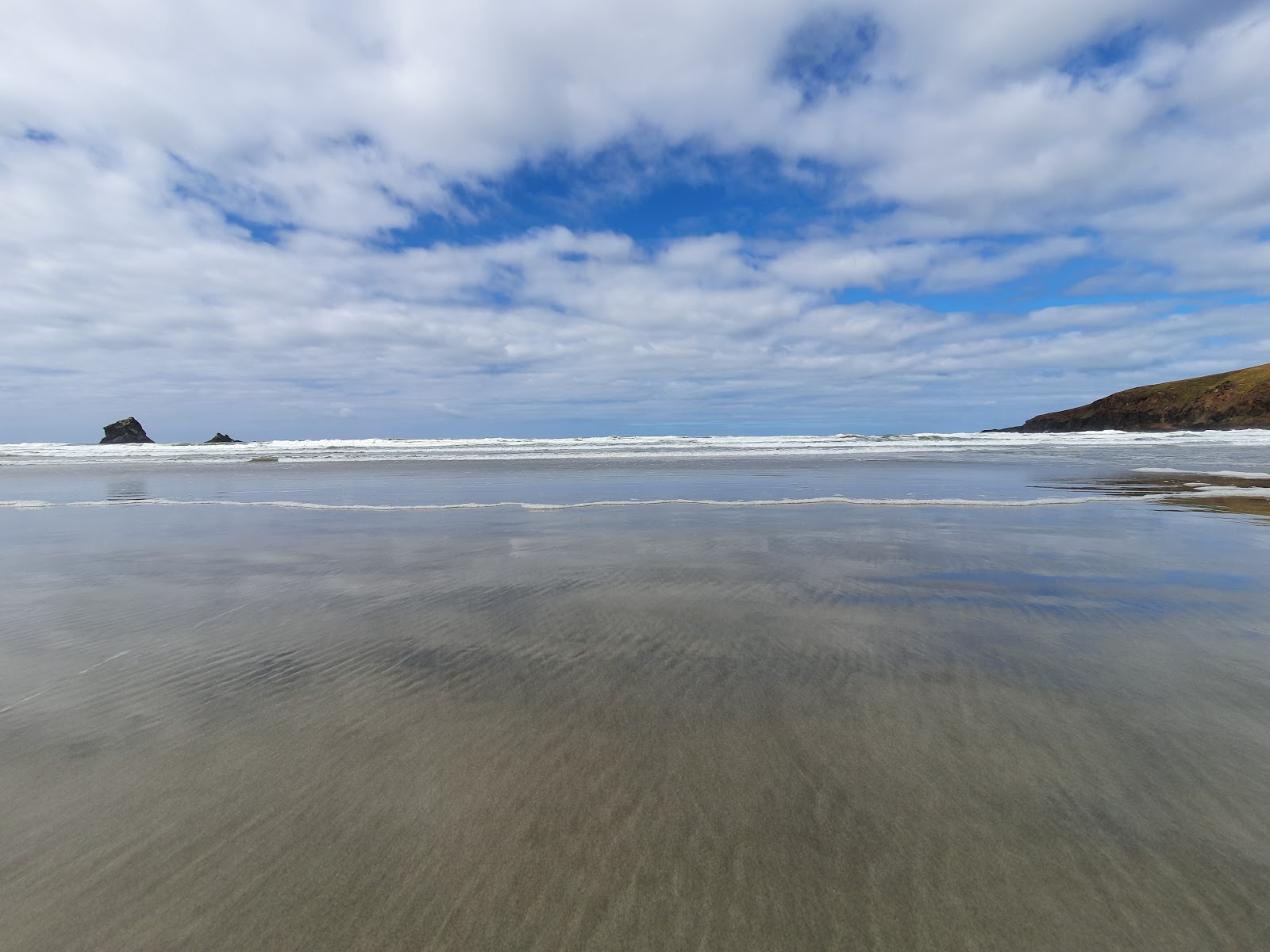 Fotografija Sandfly Bay Beach nahaja se v naravnem okolju