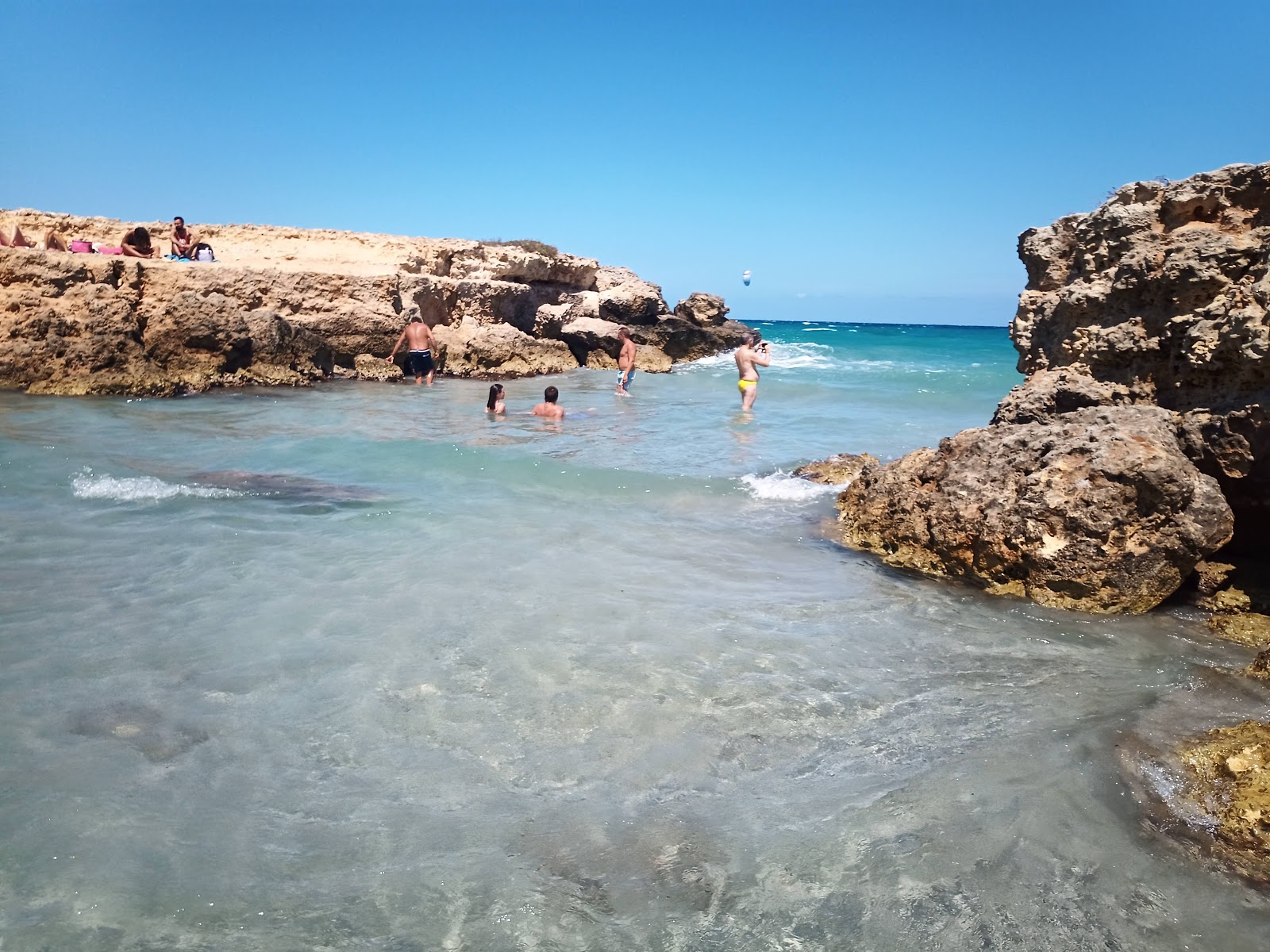 Φωτογραφία του Conca Specchiulla beach - δημοφιλές μέρος μεταξύ λάτρεις της χαλάρωσης