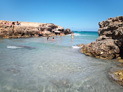 Φωτογραφία του Conca Specchiulla beach - δημοφιλές μέρος μεταξύ λάτρεις της χαλάρωσης
