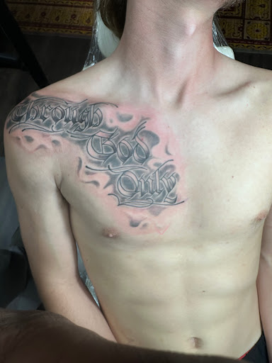 Explore dark skin male black skin tattoo ideas, creative tattoo ideas in Lake Charles, available at Brand-X Tattoo & Piercing