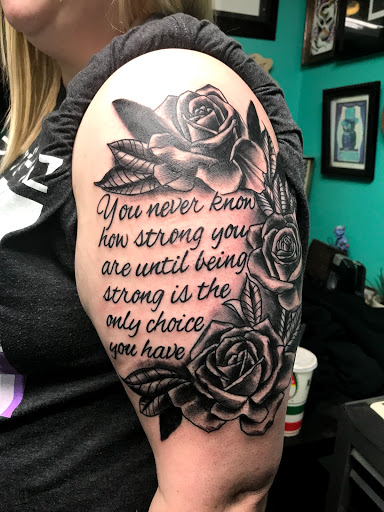Explore name tattoo ideas on neck, creative tattoo ideas in Kansas City, available at Golden Stag Tattoo and Gallery