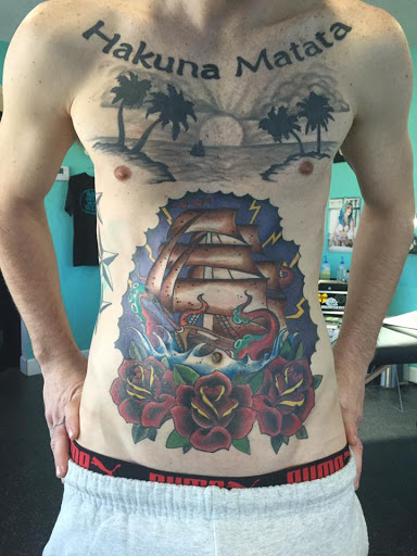 Explore lower belly tattoo ideas, creative tattoo ideas in Tarpon Springs, available at Legendary Custom Tattoos and Piercings