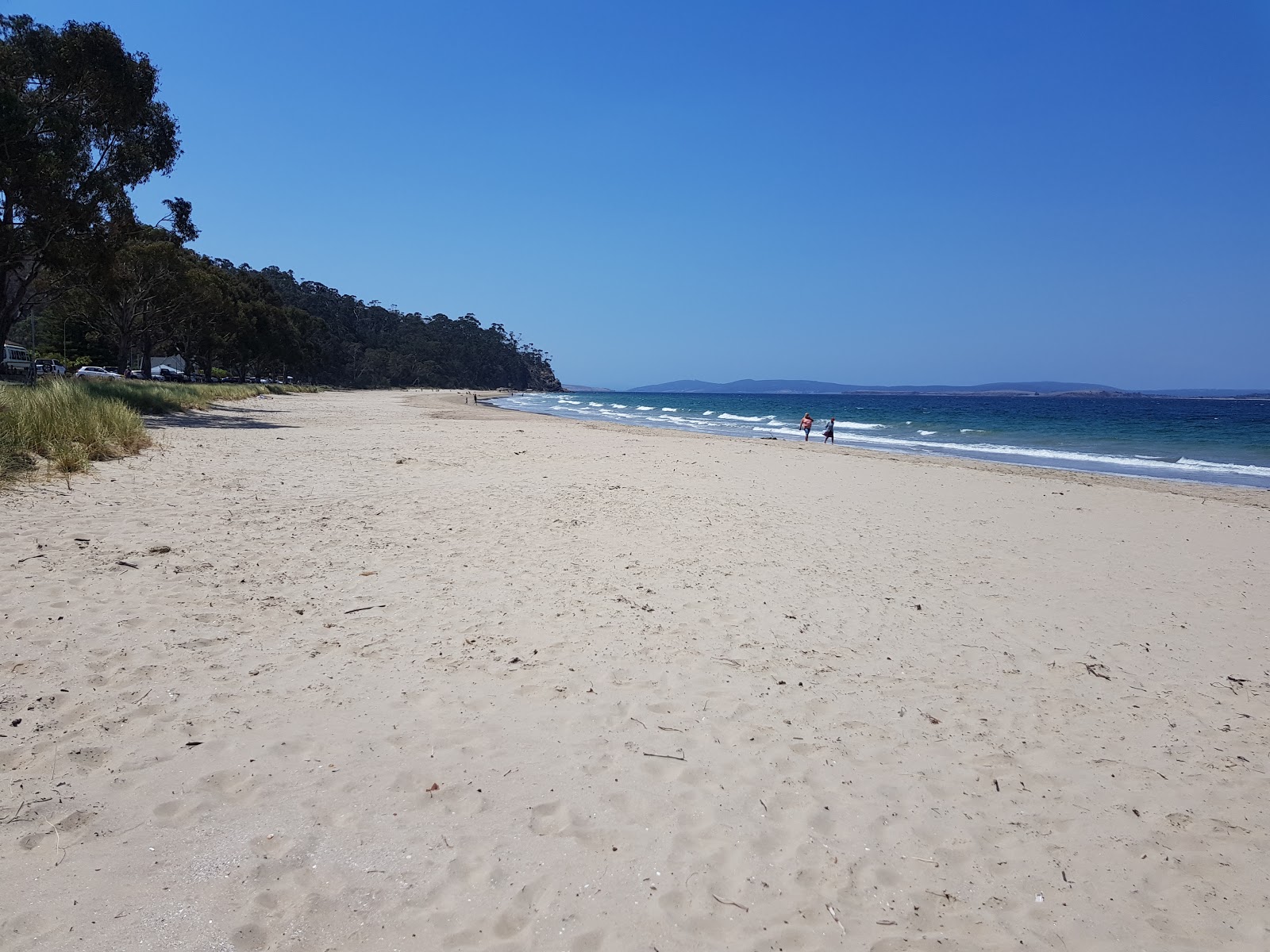Foto van Kingston Beach met helder zand oppervlakte