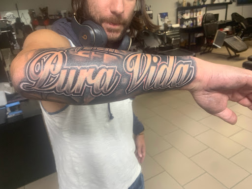 Explore wednesday tattoo ideas, creative tattoo ideas in Sarasota, available at SEVEN SINS Tattoo Studio