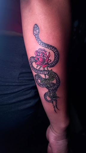 Explore back of neck tattoo ideas, creative tattoo ideas in Miami, available at Tatt Em Up Tattoos & Piercings