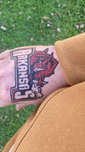 Explore back of hand tattoo ideas, creative tattoo ideas in Angola, available at Hoodlum Ink