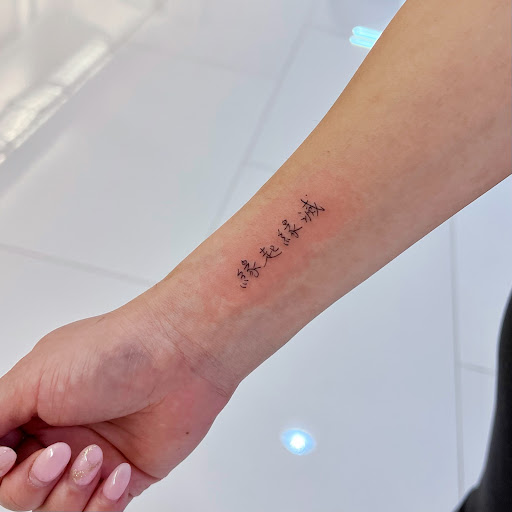 Explore cosmos flower tattoo ideas, creative tattoo ideas in Orange, available at Baron Art Tattoo