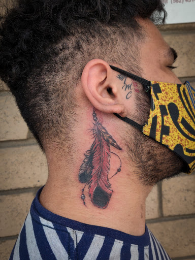 Explore last name back tattoo ideas, creative tattoo ideas in Los Alamitos, available at Mr. Inkwells Classy Tattoos
