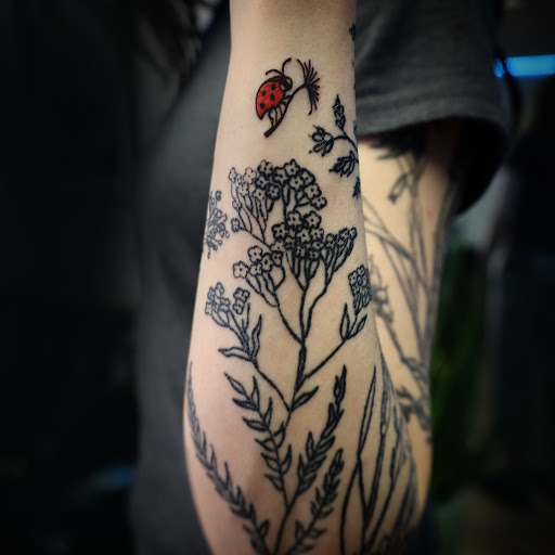 Explore ladies wrist tattoo ideas, creative tattoo ideas in Broomfield, available at Wild Child Tattoo