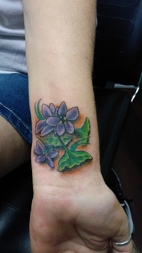 Explore women back tattoo ideas, creative tattoo ideas in Pinellas Park, available at Lollis Studios Tattoo Company