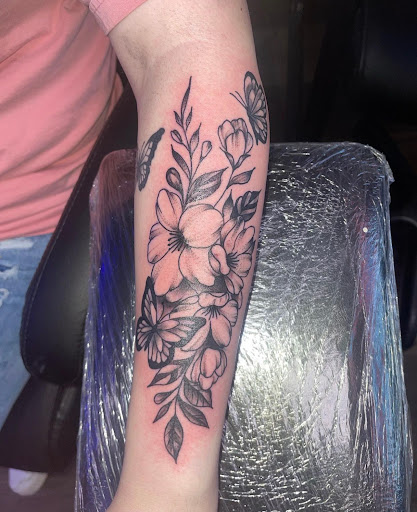 Explore cover up tattoo ideas for upper arm, creative tattoo ideas in Orange Park, available at Big City Tattoo and Piercing