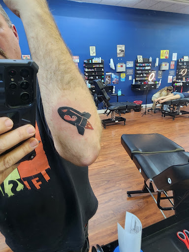 Explore cover up tattoo ideas female shoulder, creative tattoo ideas in Cocoa, available at Rorschach Tattoo Shop and Piercing Studio