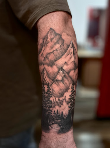 Explore peaceful tattoo ideas, creative tattoo ideas in Lander, available at Blackblood Tattoo and Piercing