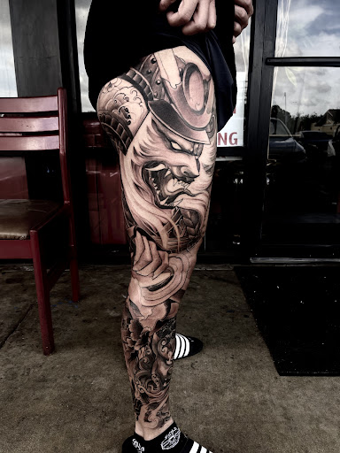 Find lion hand tattoo ideas for men for your next unique tattoo in Garden Grove at Red Blossom Art Studio