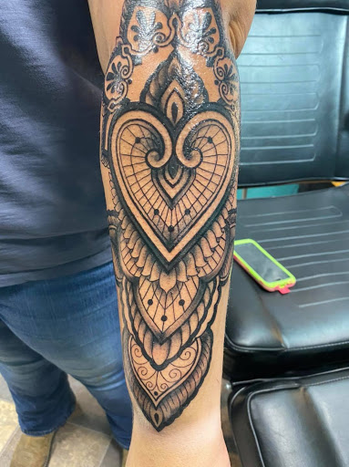 Explore heart tattoo ideas with names, creative tattoo ideas in Osceola, available at Valley Of The Inkd