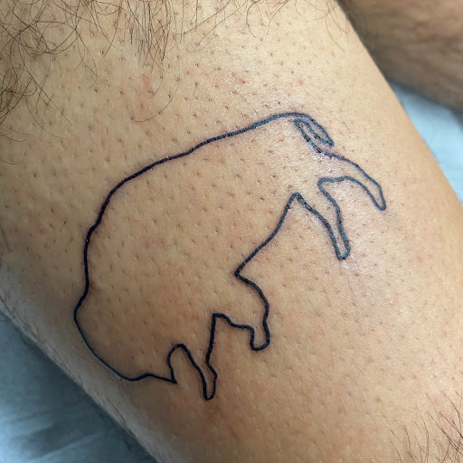 Find angel hand tattoo ideas for your next unique tattoo in Buffalo at True Gloom Tattoo Studio